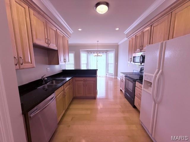 205 Prominence Ln, Lake St Louis, MO 63367 - kitchen with stainless steel appliances, ornamental molding, a chandelier, a peninsula, and dark countertops