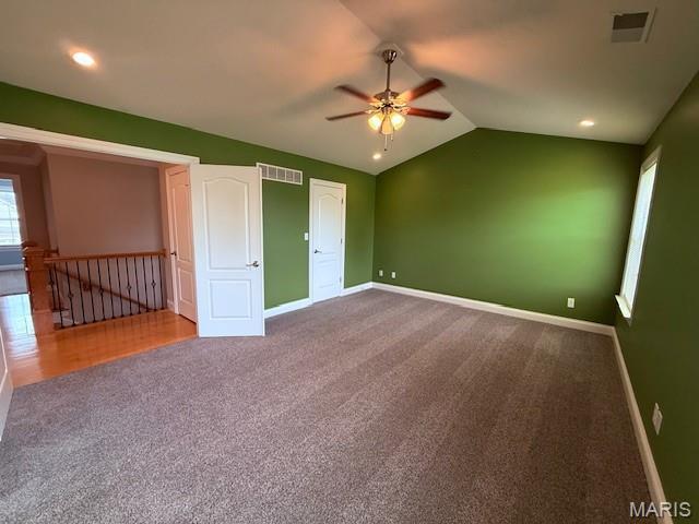 205 Prominence Ln, Lake St Louis, MO 63367 - unfurnished bedroom with carpet, vaulted ceiling, and ceiling fan