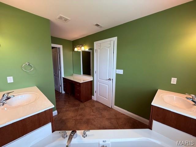 205 Prominence Ln, Lake St Louis, MO 63367 - full bathroom featuring two vanities and a bath
