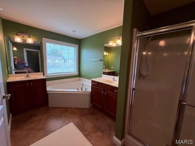 205 Prominence Ln, Lake St Louis, MO 63367 - full bath with a shower stall, a garden tub, two vanities, and tile patterned flooring