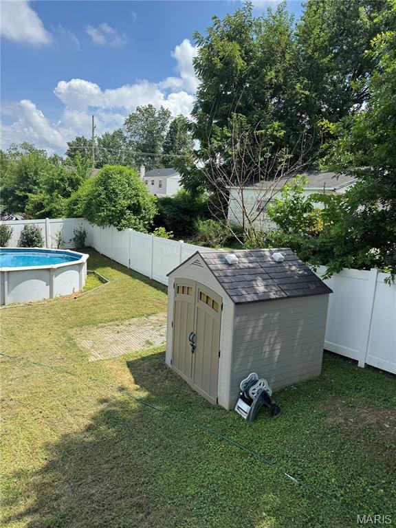 8506 Mathilda Ave, Saint Louis, MO 63123 - fenced backyard with a storage unit