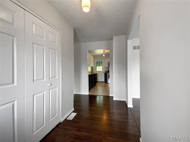 68 W Lakewood Dr, Fenton, MO 63026 - hall with wood finished floors and a textured ceiling