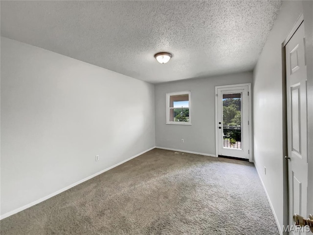 68 W Lakewood Dr, Fenton, MO 63026 - carpeted empty room featuring baseboards and a textured ceiling