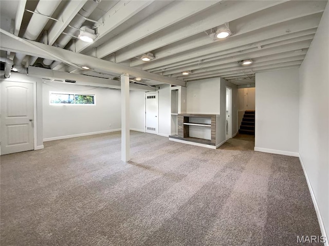 68 W Lakewood Dr, Fenton, MO 63026 - below grade area featuring stairway and carpet floors