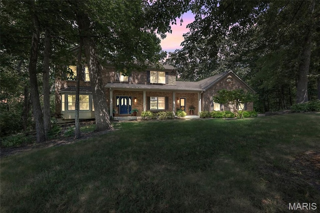 16517 Lancaster Estates Dr, Grover, MO 63040 - view of front of property featuring brick siding and a front lawn