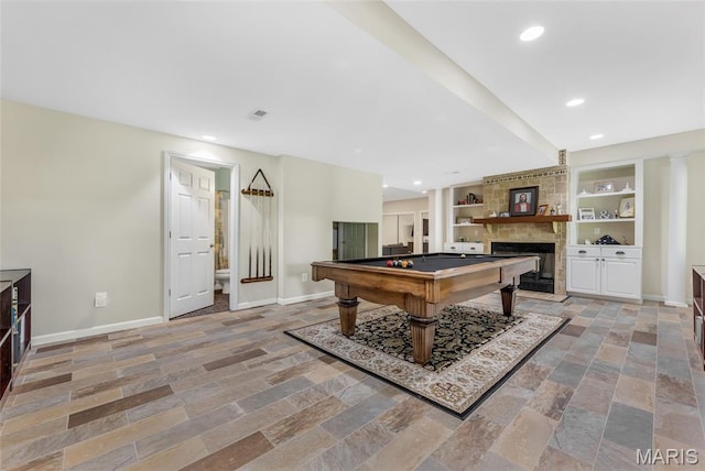 16517 Lancaster Estates Dr, Grover, MO 63040 - rec room with a fireplace, billiards table, stone tile flooring, built in shelves, and recessed lighting
