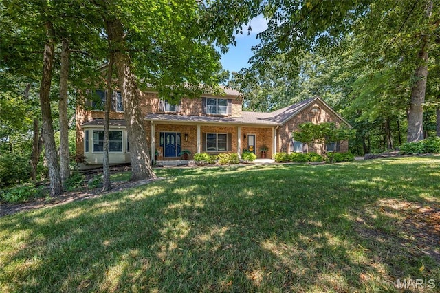 16517 Lancaster Estates Dr, Grover, MO 63040 - view of front of property featuring brick siding and a front yard