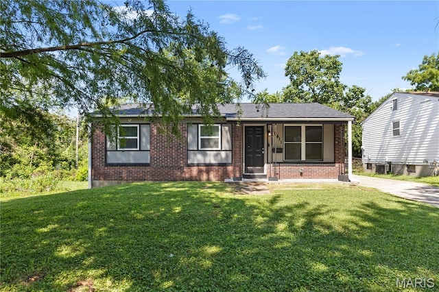 10411 Royal Dr, Saint Louis, MO 63136 - view of front of property with brick siding and a front lawn