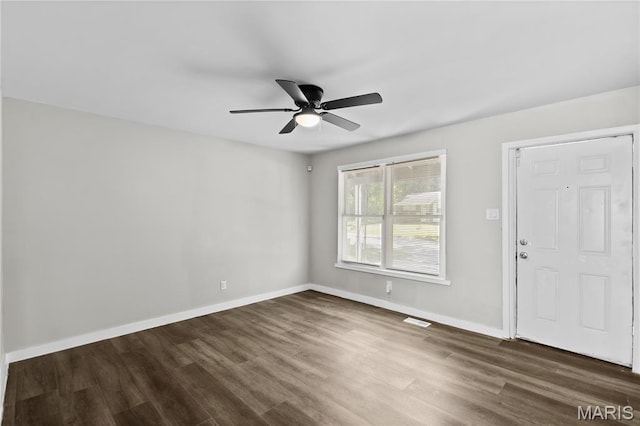 10411 Royal Dr, Saint Louis, MO 63136 - spare room featuring a ceiling fan and dark wood-style floors