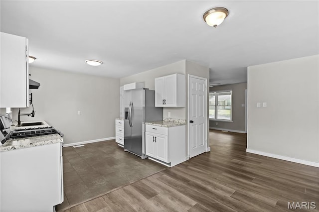 10411 Royal Dr, Saint Louis, MO 63136 - kitchen featuring stainless steel fridge with ice dispenser, white cabinets, dark wood-style floors, ventilation hood, and light stone counters