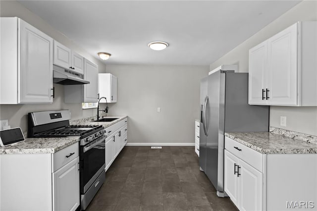 10411 Royal Dr, Saint Louis, MO 63136 - kitchen with appliances with stainless steel finishes, under cabinet range hood, and white cabinetry