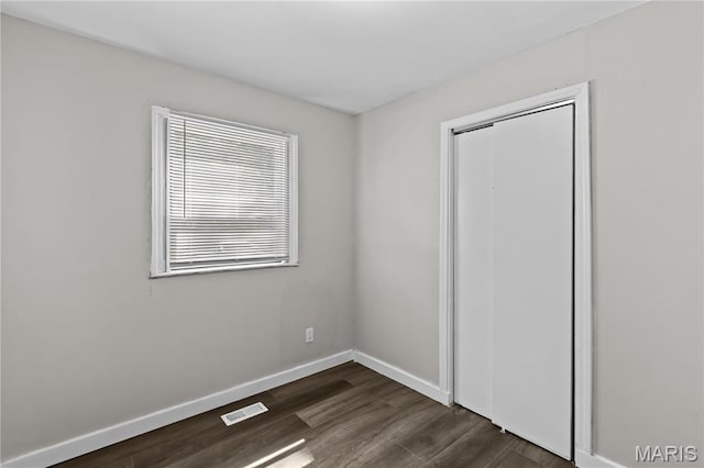 10411 Royal Dr, Saint Louis, MO 63136 - unfurnished room with dark wood-type flooring and baseboards