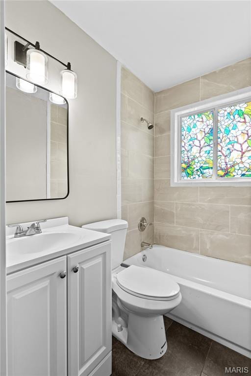 10411 Royal Dr, Saint Louis, MO 63136 - full bathroom with vanity, tile patterned flooring, and washtub / shower combination