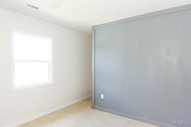320 E Davidson Ave, Chaffee, MO 63740 - empty room with light wood-style floors and baseboards
