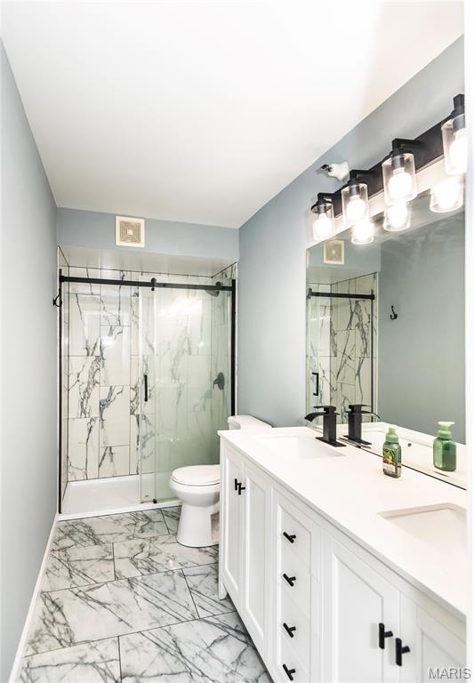 3624 Colonia Pl Unit B, Saint Louis, MO 63125 - bathroom featuring marble finish floors, a marble finish shower, and double vanity