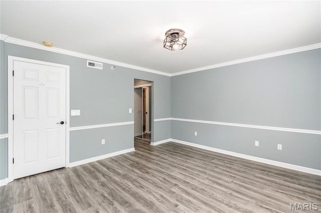 3624 Colonia Pl Unit B, Saint Louis, MO 63125 - spare room featuring wood finished floors, ornamental molding, and a smoke detector