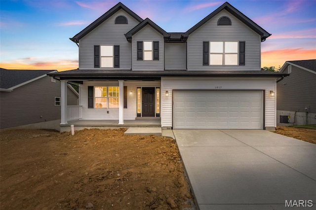 1917 Magnolia Way, Pevely, MO 63070 - traditional-style home featuring covered porch, driveway, and an attached garage