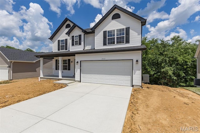 1917 Magnolia Way, Pevely, MO 63070 - traditional home with a porch, a garage, and concrete driveway