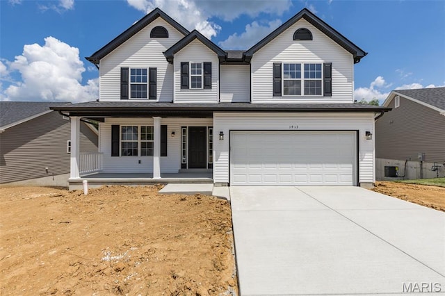 1917 Magnolia Way, Pevely, MO 63070 - traditional home with a porch, an attached garage, and driveway
