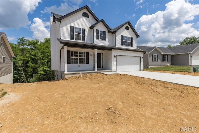 1917 Magnolia Way, Pevely, MO 63070 - traditional-style house with covered porch, concrete driveway, and a garage