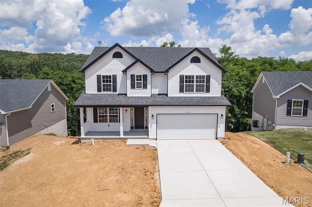 1917 Magnolia Way, Pevely, MO 63070 - traditional home with concrete driveway, a porch, a garage, and roof with shingles
