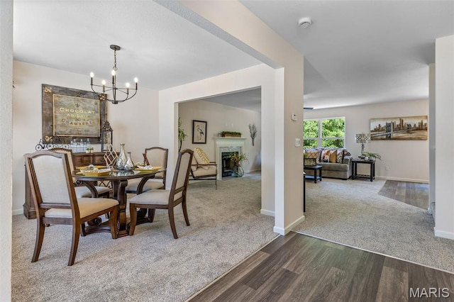 1917 Magnolia Way, Pevely, MO 63070 - dining area with dark carpet, a chandelier, and dark wood-style floors