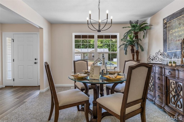 1917 Magnolia Way, Pevely, MO 63070 - dining room with a chandelier, carpet flooring, and wood finished floors
