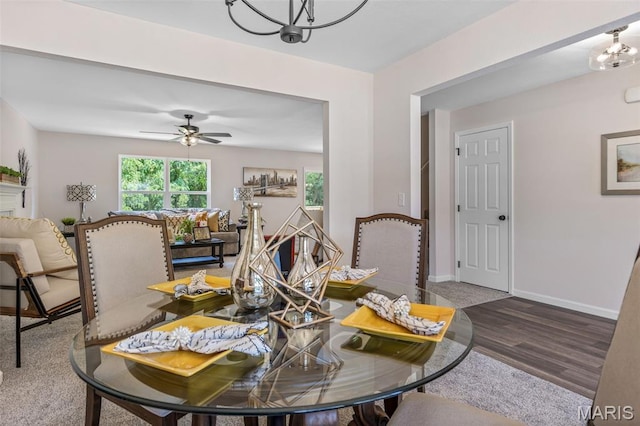 1917 Magnolia Way, Pevely, MO 63070 - dining space featuring a chandelier, wood finished floors, and a ceiling fan