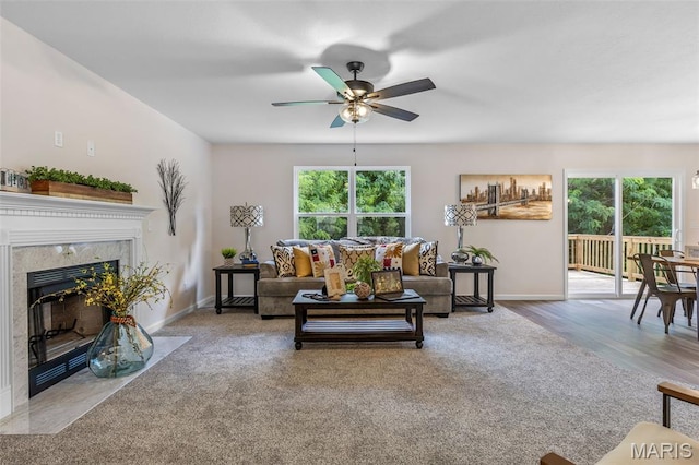 1917 Magnolia Way, Pevely, MO 63070 - living area with ceiling fan, carpet, and a fireplace