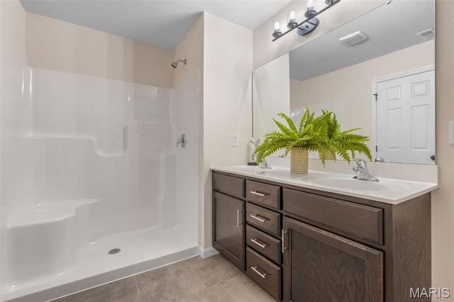 1917 Magnolia Way, Pevely, MO 63070 - full bath with double vanity, a shower, and tile patterned floors