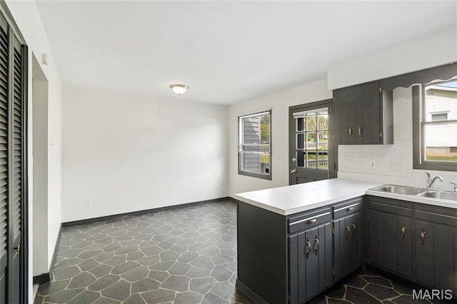 2516 Westminister Dr, Saint Charles, MO 63301 - kitchen with a peninsula, backsplash, and light countertops