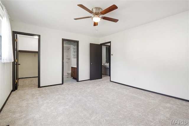 2516 Westminister Dr, Saint Charles, MO 63301 - unfurnished bedroom with light colored carpet, ensuite bathroom, a spacious closet, and a ceiling fan