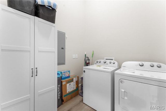 68 Meg Marie Ln Unit B, Branson, MO 65616 - laundry area featuring separate washer and dryer, electric panel, cabinet space, and light wood-style floors