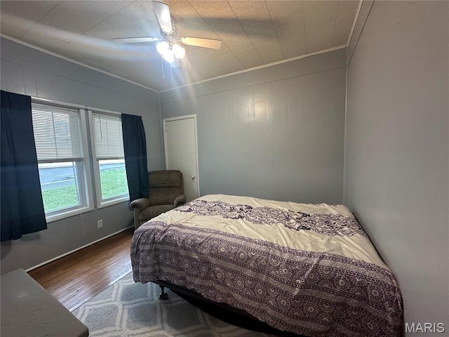 806 Pleasant St, Hannibal, MO 63401 - bedroom with crown molding, wood finished floors, and a ceiling fan