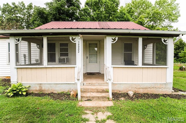 15902 County Road 7520, Newburg, MO 65550 - view of front of house with a metal roof and a porch
