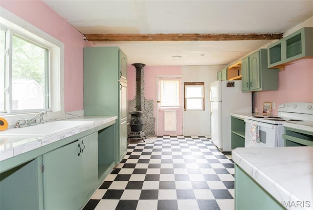 15902 County Road 7520, Newburg, MO 65550 - kitchen featuring green cabinets, white appliances, a wood stove, tile patterned floors, and beam ceiling