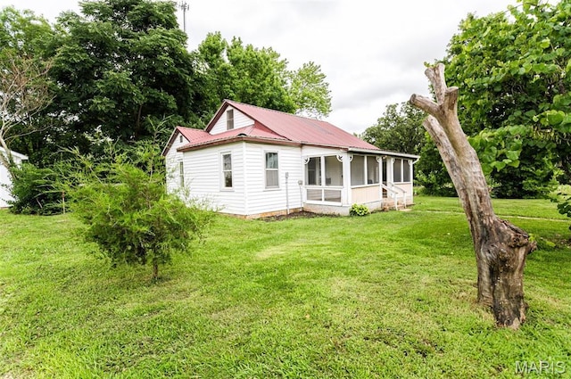 15902 County Road 7520, Newburg, MO 65550 - rear view of house featuring a sunroom, a lawn, and a metal roof
