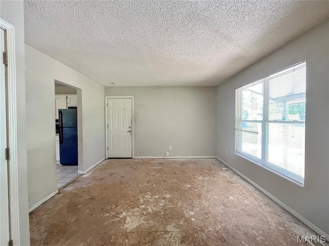 962 Martha Ave, Catawissa, MO 63015 - empty room featuring a textured ceiling and baseboards