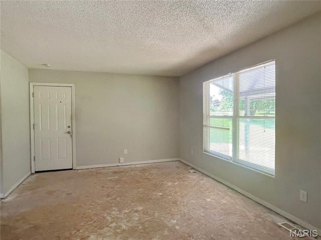962 Martha Ave, Catawissa, MO 63015 - empty room featuring a textured ceiling and baseboards