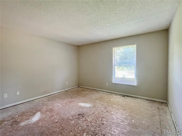 962 Martha Ave, Catawissa, MO 63015 - empty room featuring a textured ceiling and baseboards