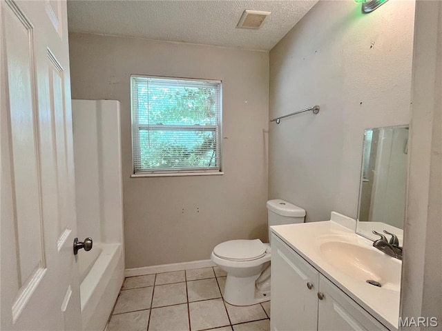 962 Martha Ave, Catawissa, MO 63015 - full bath featuring vanity, tile patterned flooring, a textured ceiling, and washtub / shower combination