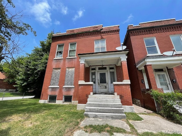 1063 Hornsby Ave, Saint Louis, MO 63147 - view of front of home featuring brick siding and a front lawn