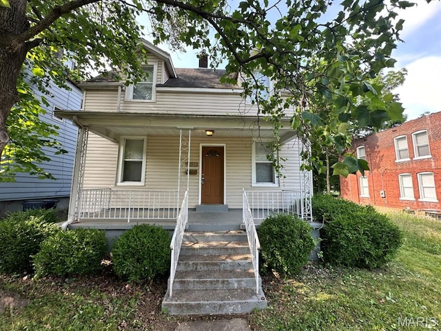 6624 Bartmer Ave, University City, MO 63130 - bungalow-style house featuring a porch