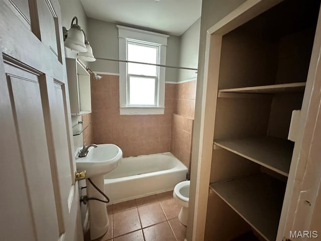 6624 Bartmer Ave, University City, MO 63130 - full bath featuring washtub / shower combination, tile patterned flooring, wainscoting, and tile walls