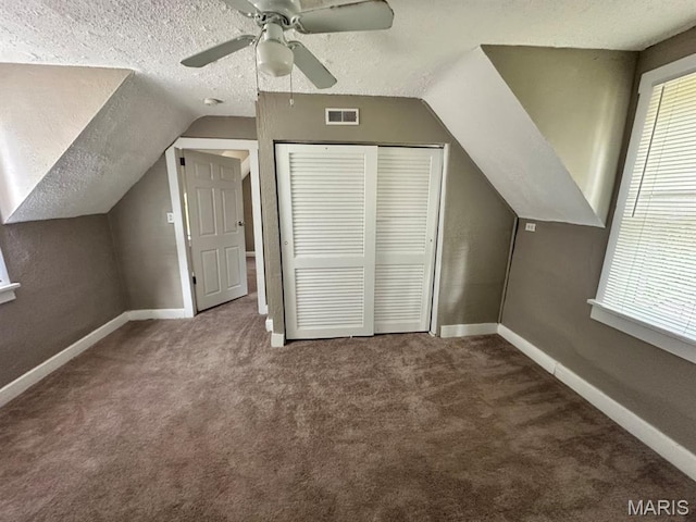 6624 Bartmer Ave, University City, MO 63130 - additional living space featuring a textured ceiling, lofted ceiling, carpet floors, and a ceiling fan