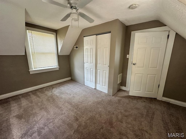 6624 Bartmer Ave, University City, MO 63130 - additional living space with vaulted ceiling, carpet, a ceiling fan, and a textured ceiling