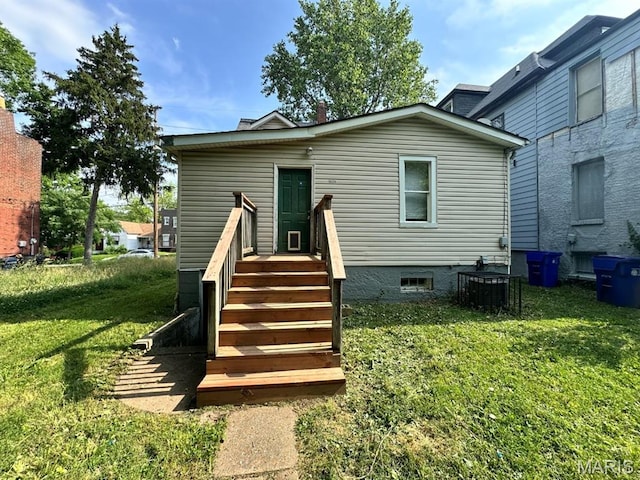 6624 Bartmer Ave, University City, MO 63130 - rear view of property featuring a lawn