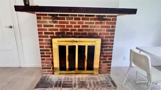 3400 Adie Rd, Saint Ann, MO 63074 - detailed view of a fireplace and wood finished floors