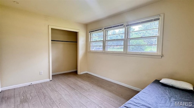 3400 Adie Rd, Saint Ann, MO 63074 - bedroom with wood finished floors and a closet