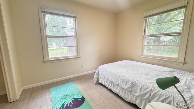 3400 Adie Rd, Saint Ann, MO 63074 - bedroom featuring multiple windows and wood-type flooring